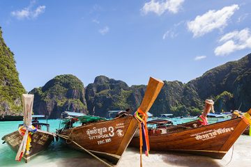 A beautiful beach with boats in Thailand